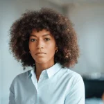 serious businesswoman by wall work 600nw 2138392873